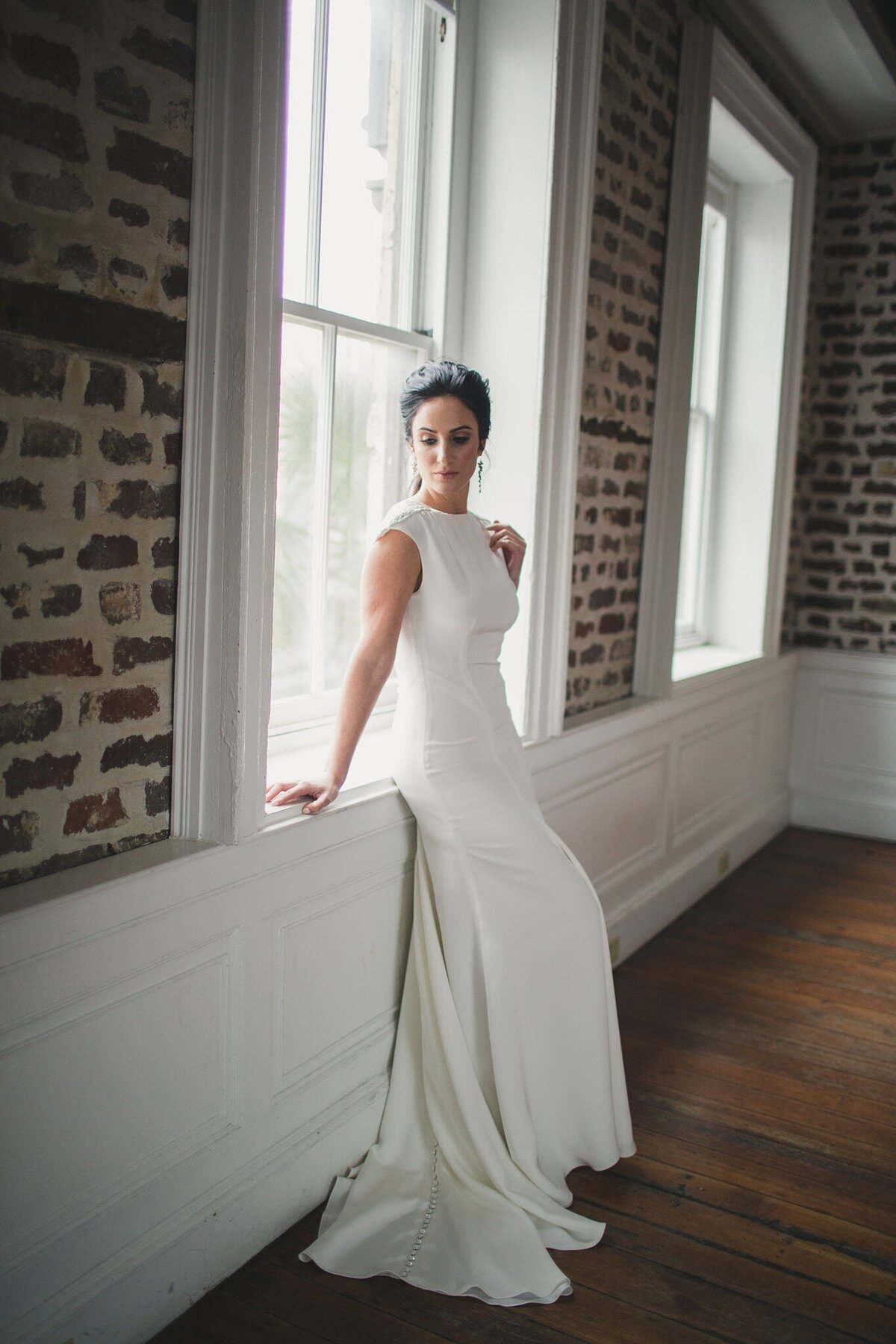 The clean lines and subtle sparkle details of the Tamarisk crepe wedding gown make this a timeless bridal style.