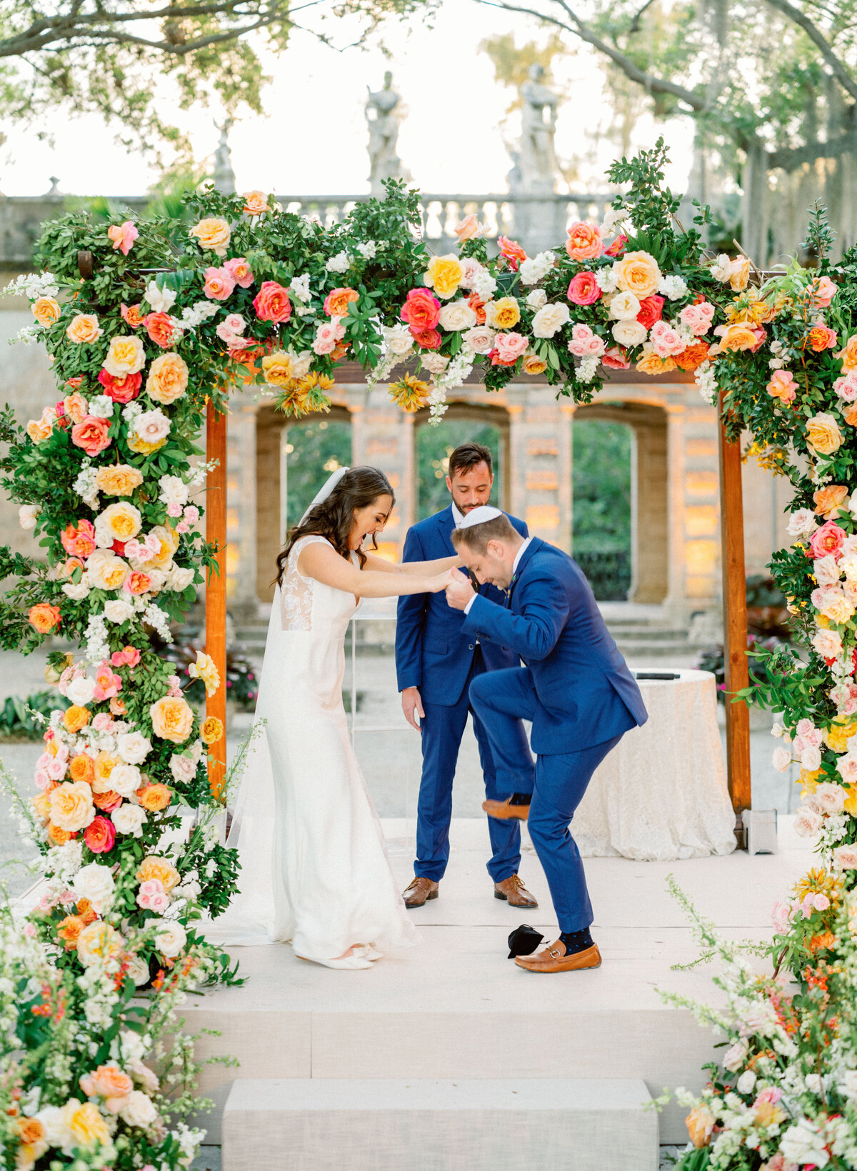 chuppah decorated in bright flowers