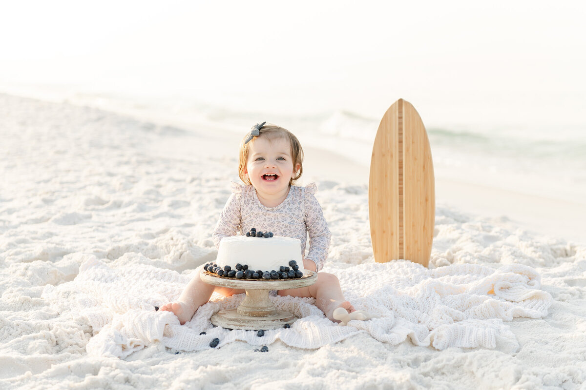 A baby girl on the beach captured by a talented destin family photographer.