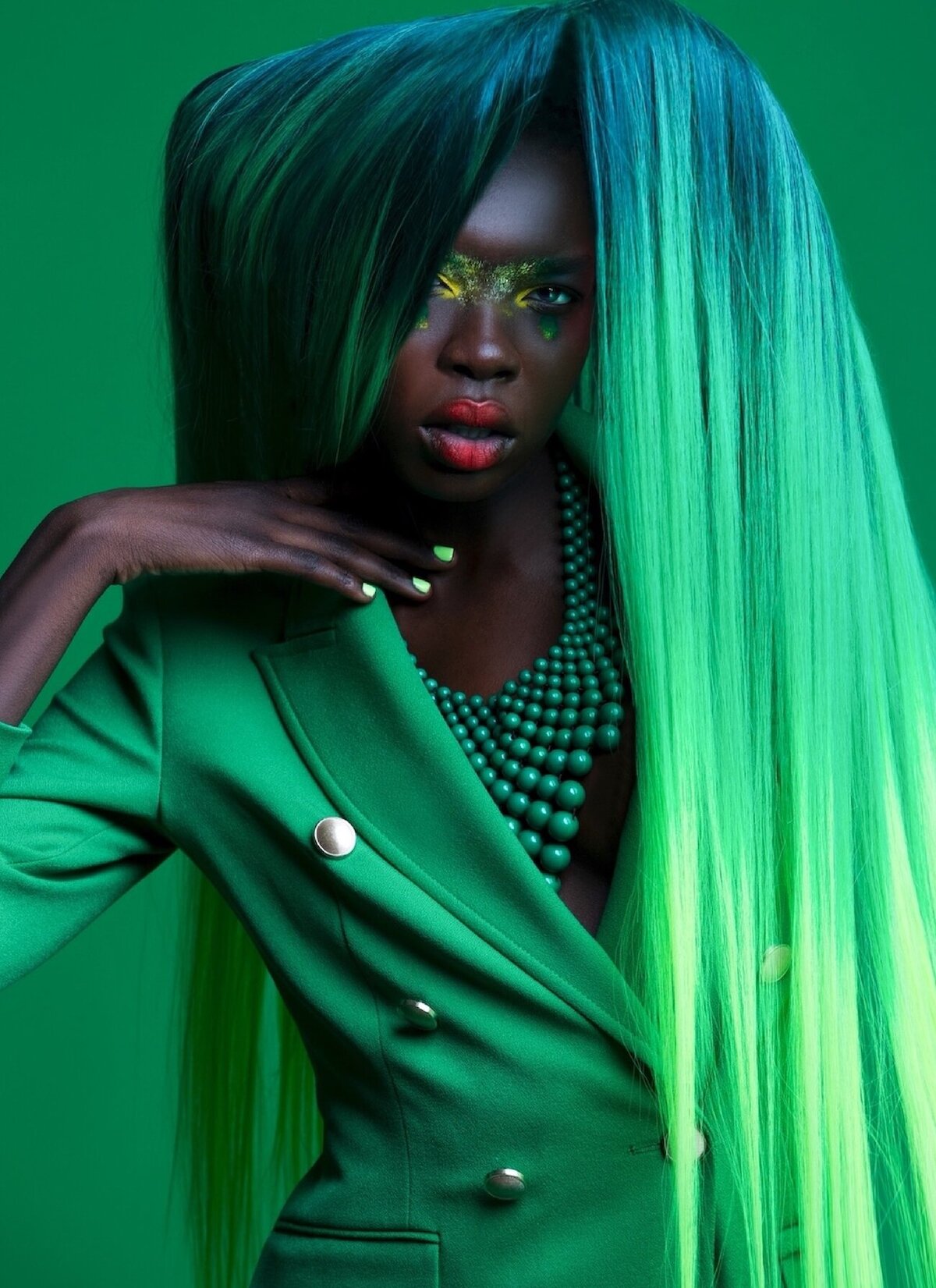 black-woman-colorful-editorial-makeup-green-hair-outfit