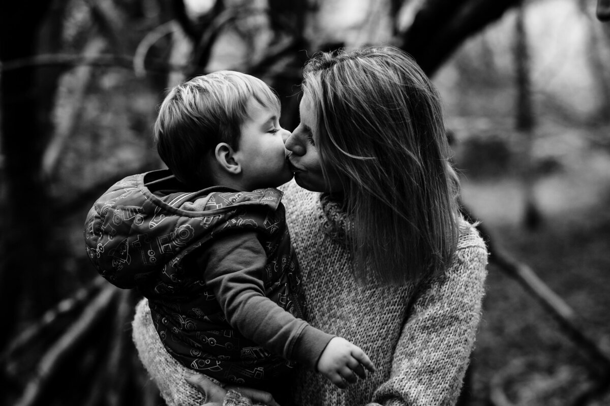 Mum kissing her son during family photoshoot in rutland with Amanda Forman photography