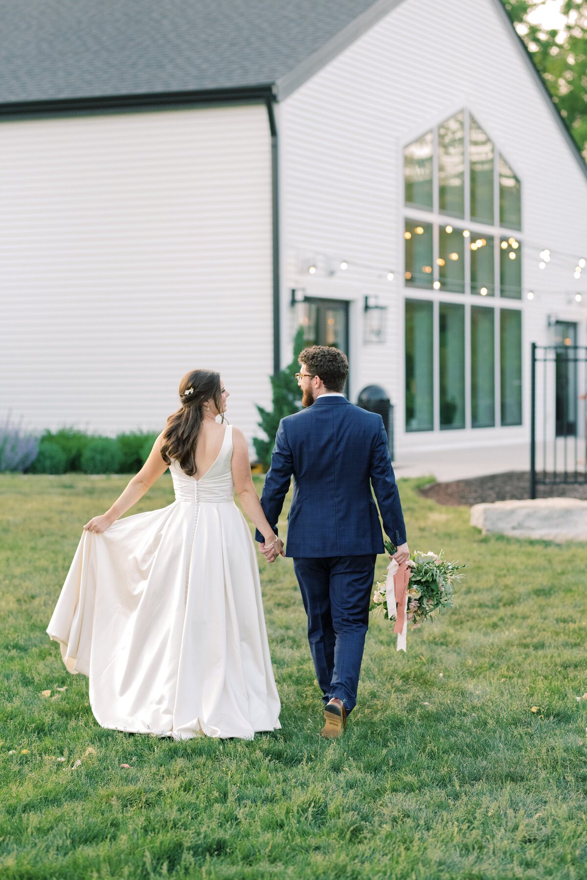 married couple walking to back patio