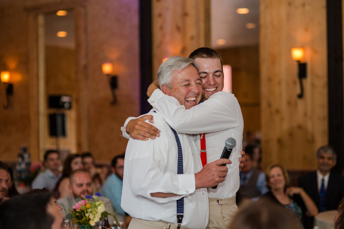 moment between son and father wedding day