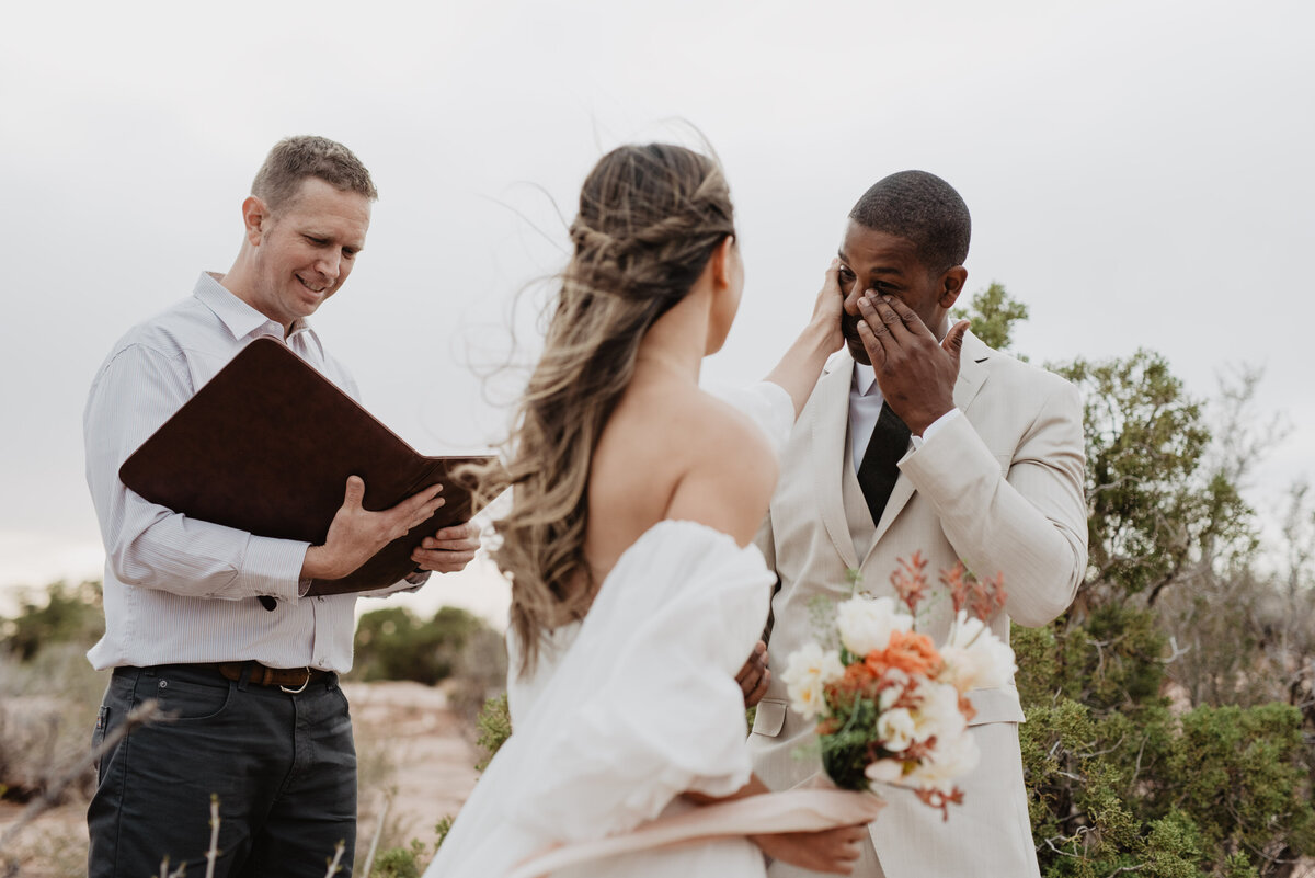 Utah Elopement Photographer captures bride wiping tears