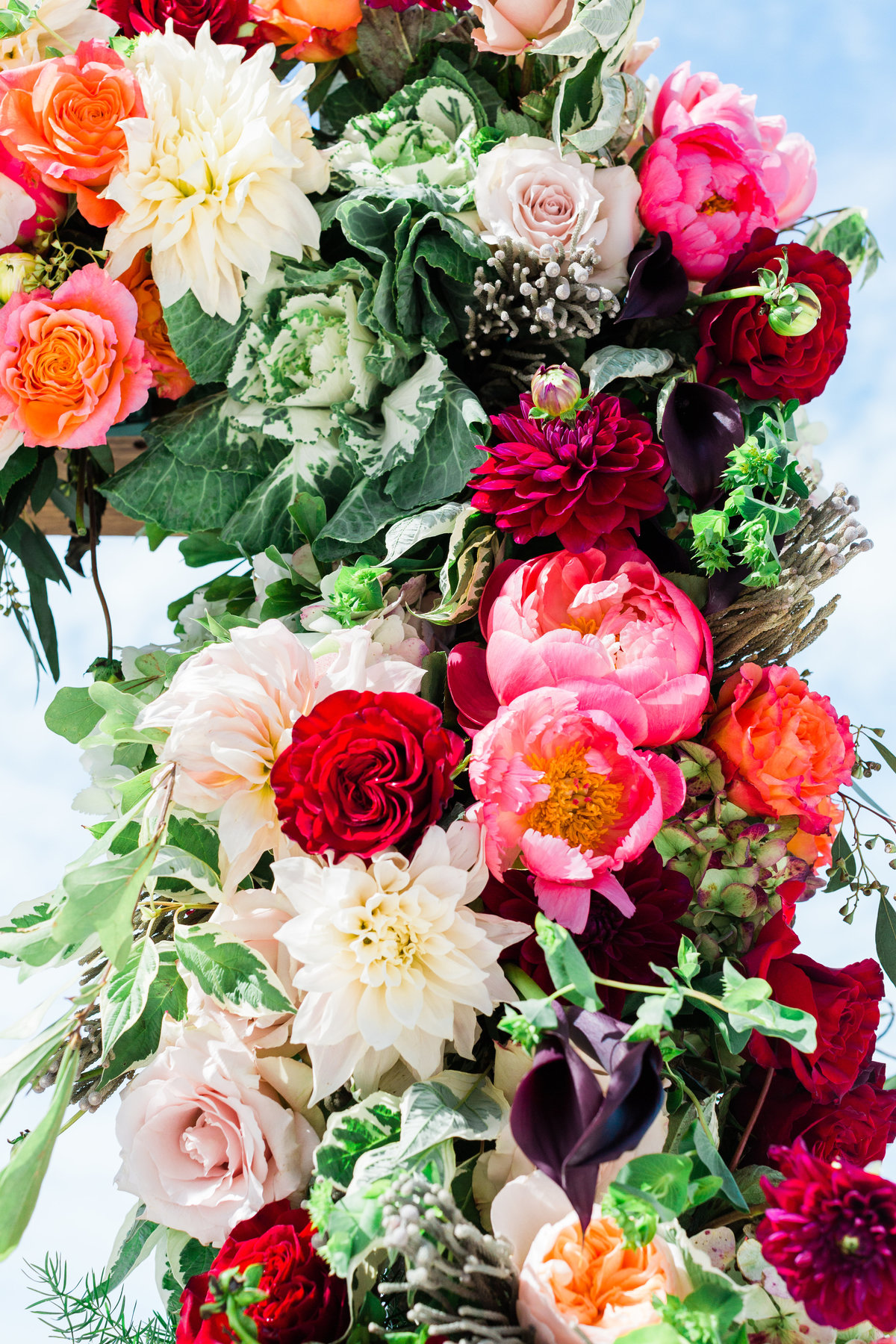 vibrant wedding flowers arch