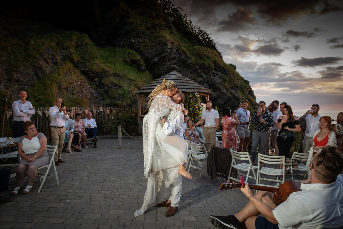 Outside first dance at Tunnels Beaches wedding venue in Devon