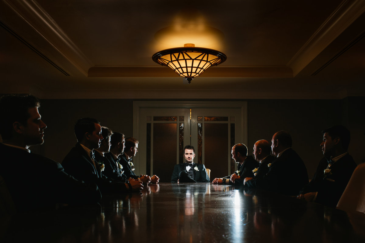 Editorial and dramatic photograph of groomsmen