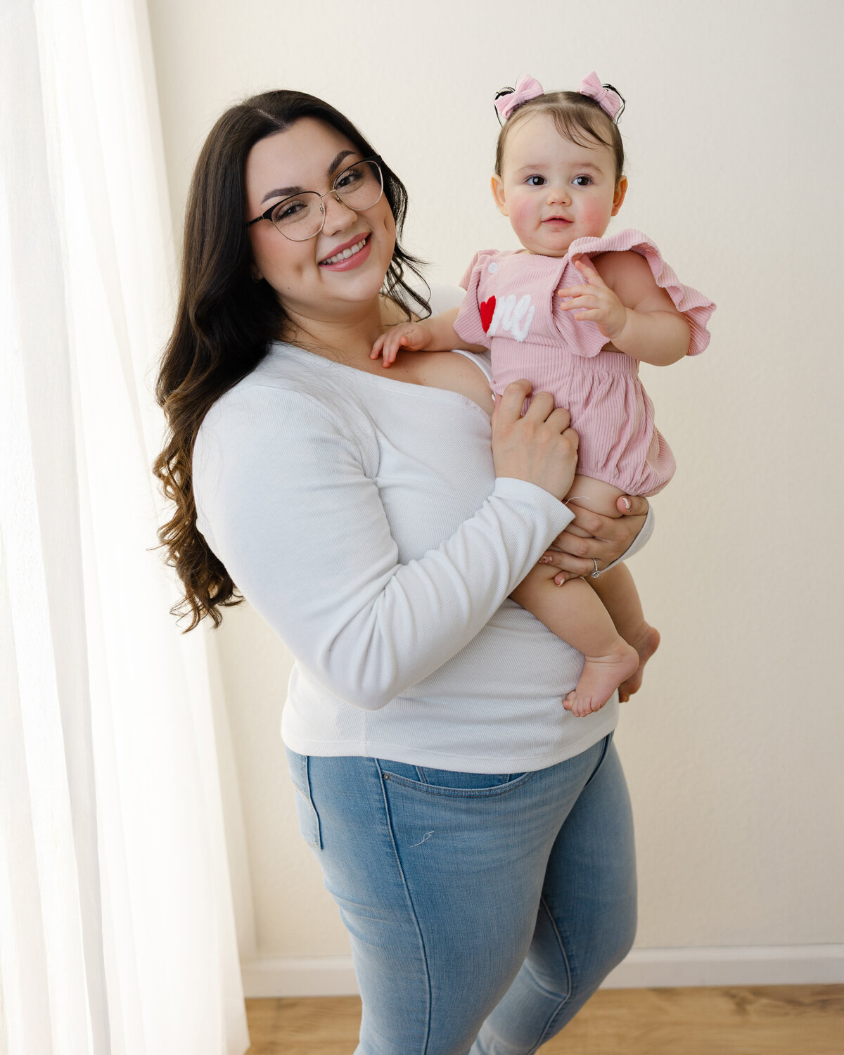 Wrapped in love and celebrating one sweet year together. This mama and her birthday girl shared the most joyful moments during their cake smash session. Captured by Yucaipa cake smash photographer Kaitlyn Dawn Photography.