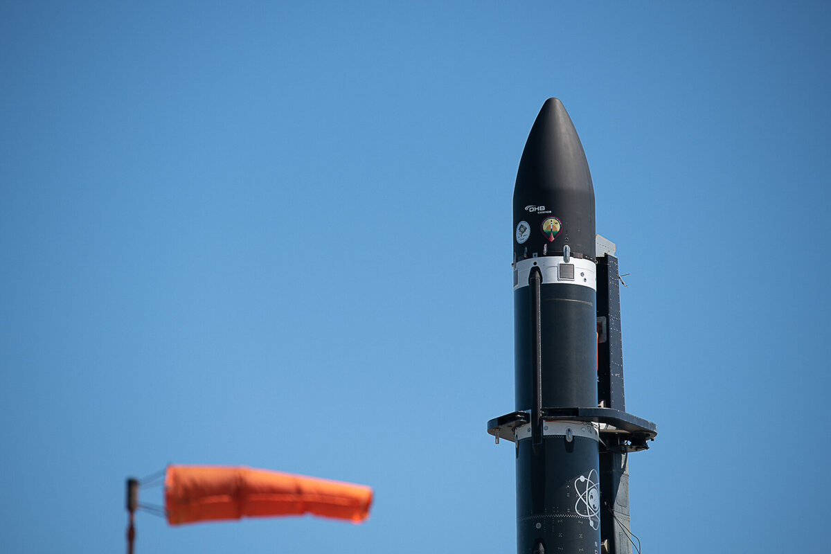 Rocketlab's electron Rocket. Vertical for launch. Detail of fairing showing windsock in foreground.