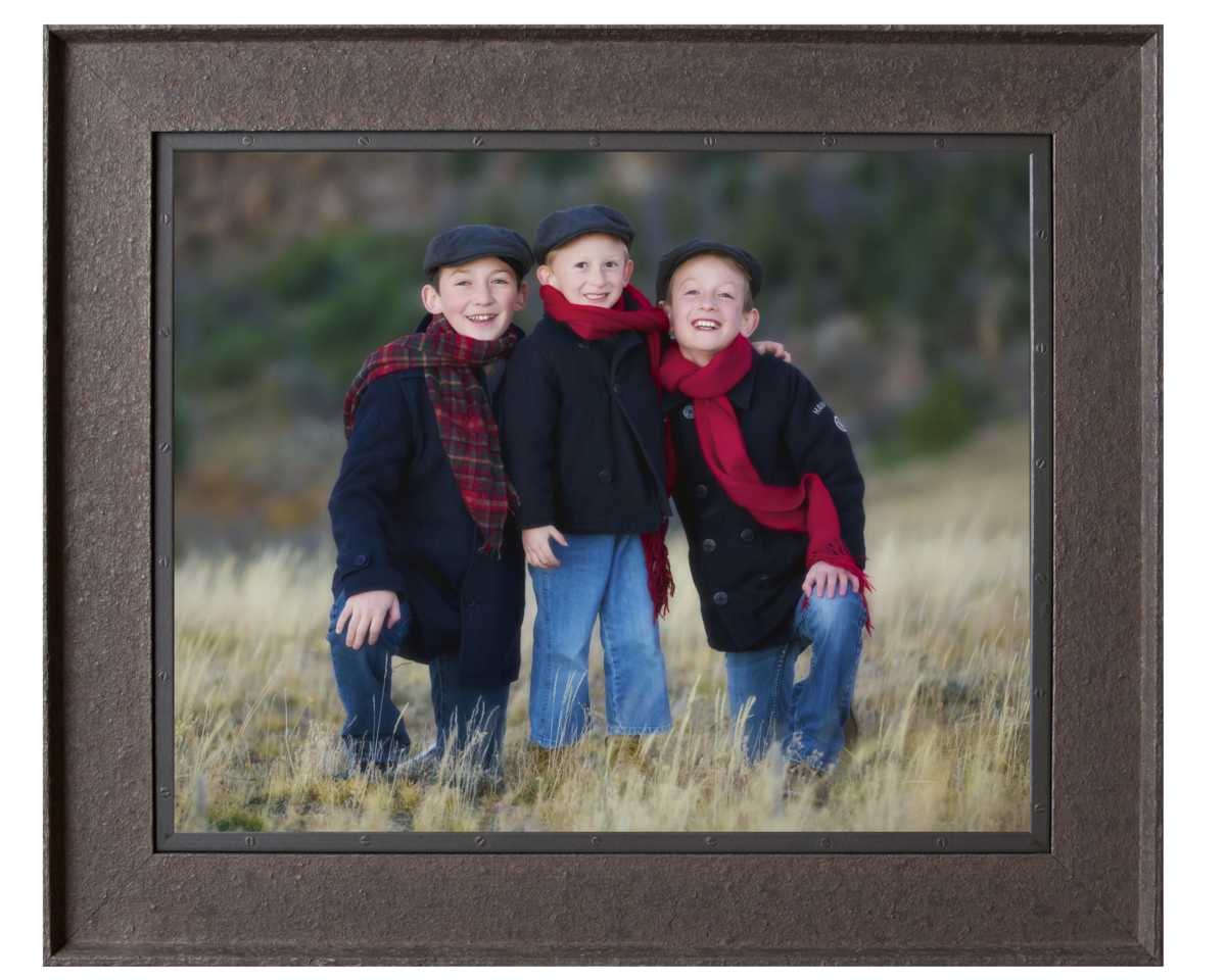 Boys dressed in navy with red scarfs in the Vedauwoo mountains.