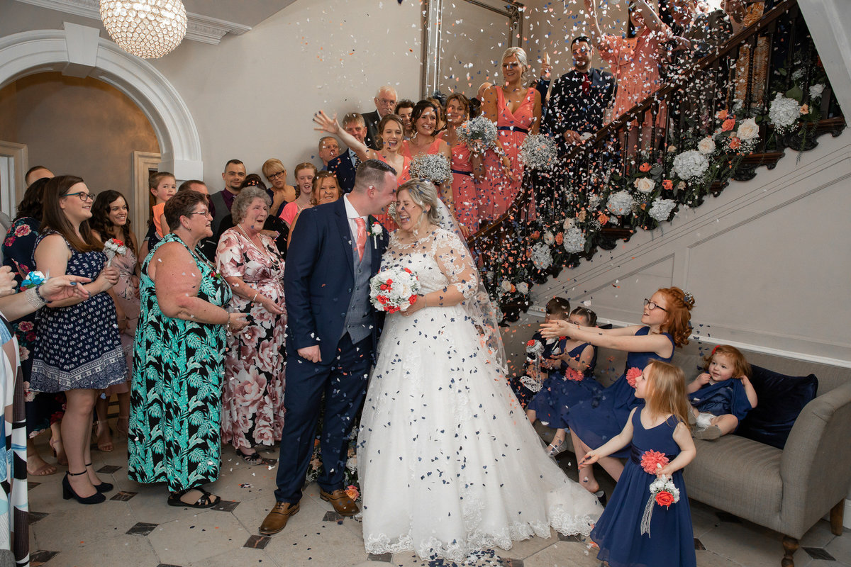 Confetti on stairs at Rockbeare Manor wedding Exeter_