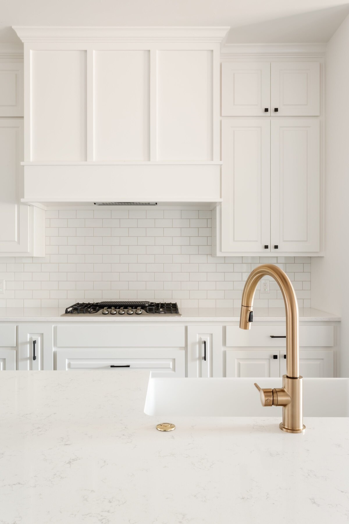 Marcie Meredith Texas based interior design photography. White kitchen gold faucet
