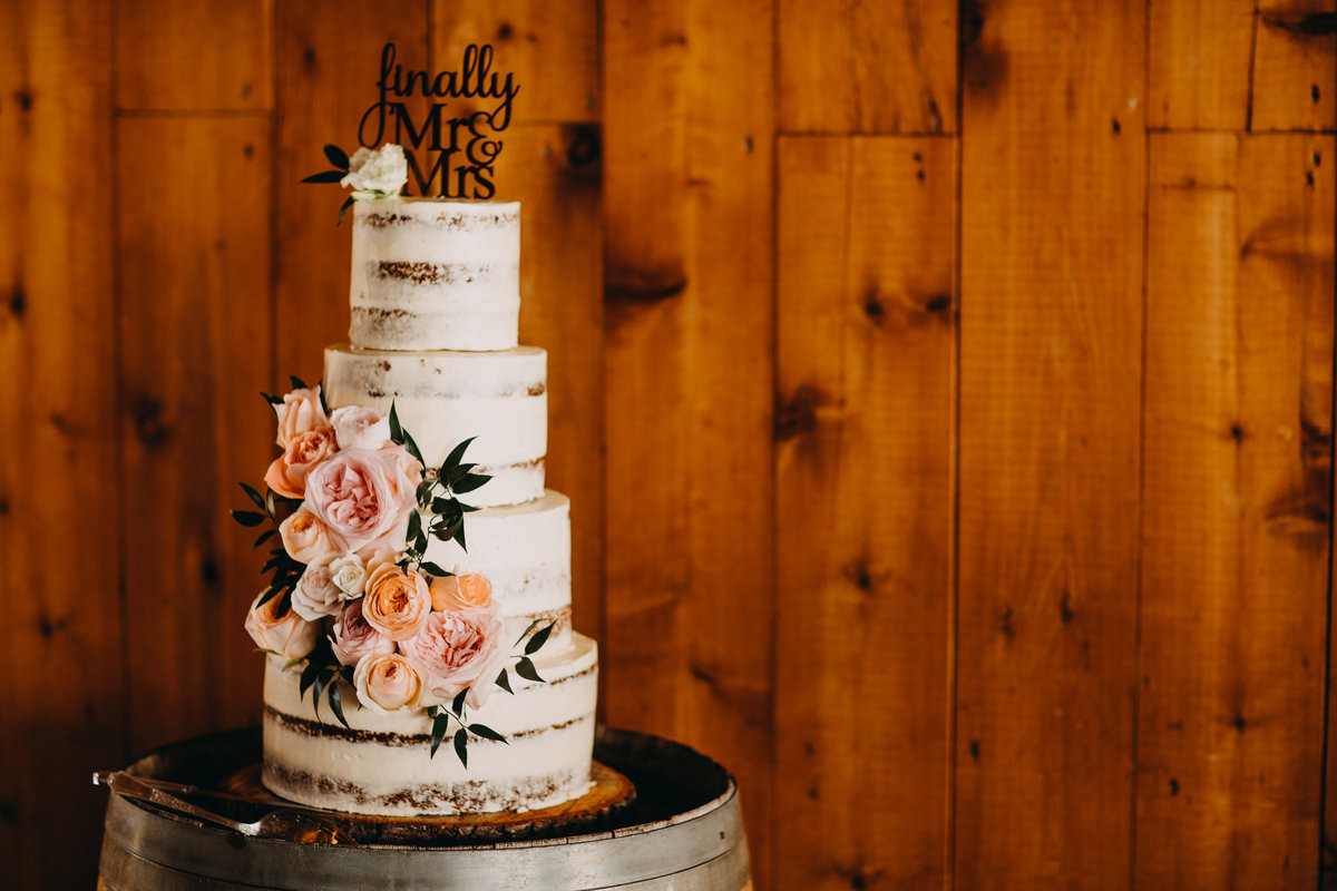 Image of a cake with pink decorations at Snohomish wedding.