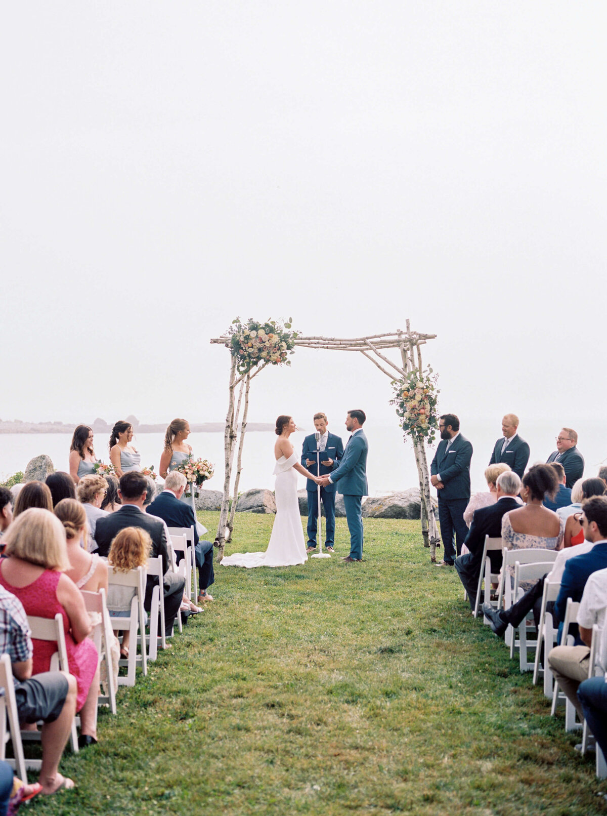 Wedding ceremony on the water edge at Oceanstone Resort Wedding in Nova Scotia