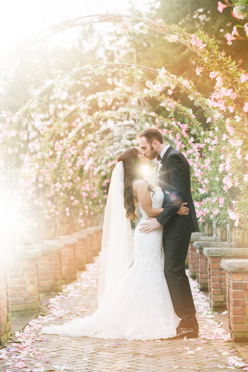 romantic floral sunset summer kiss dramatic wedding photography embrace bright airy