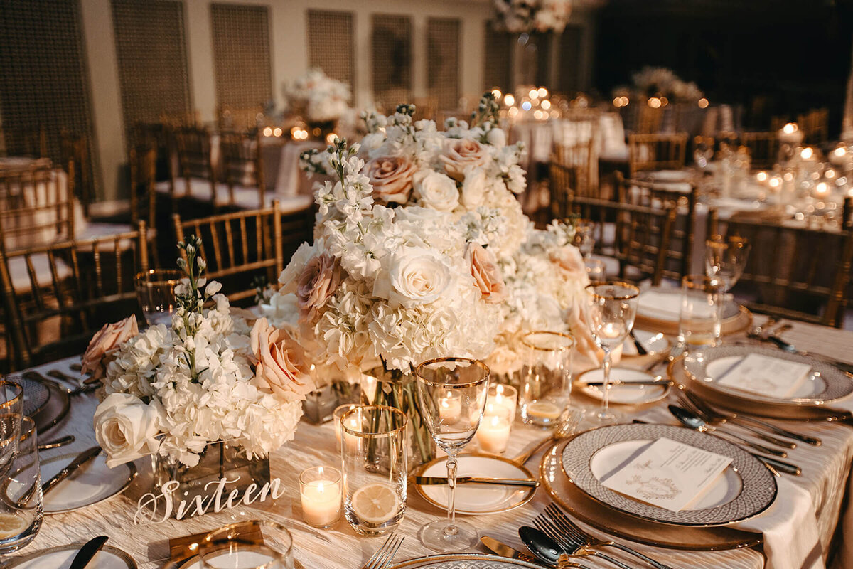 white blush and peach roses and hydrangea wedding centerpiece