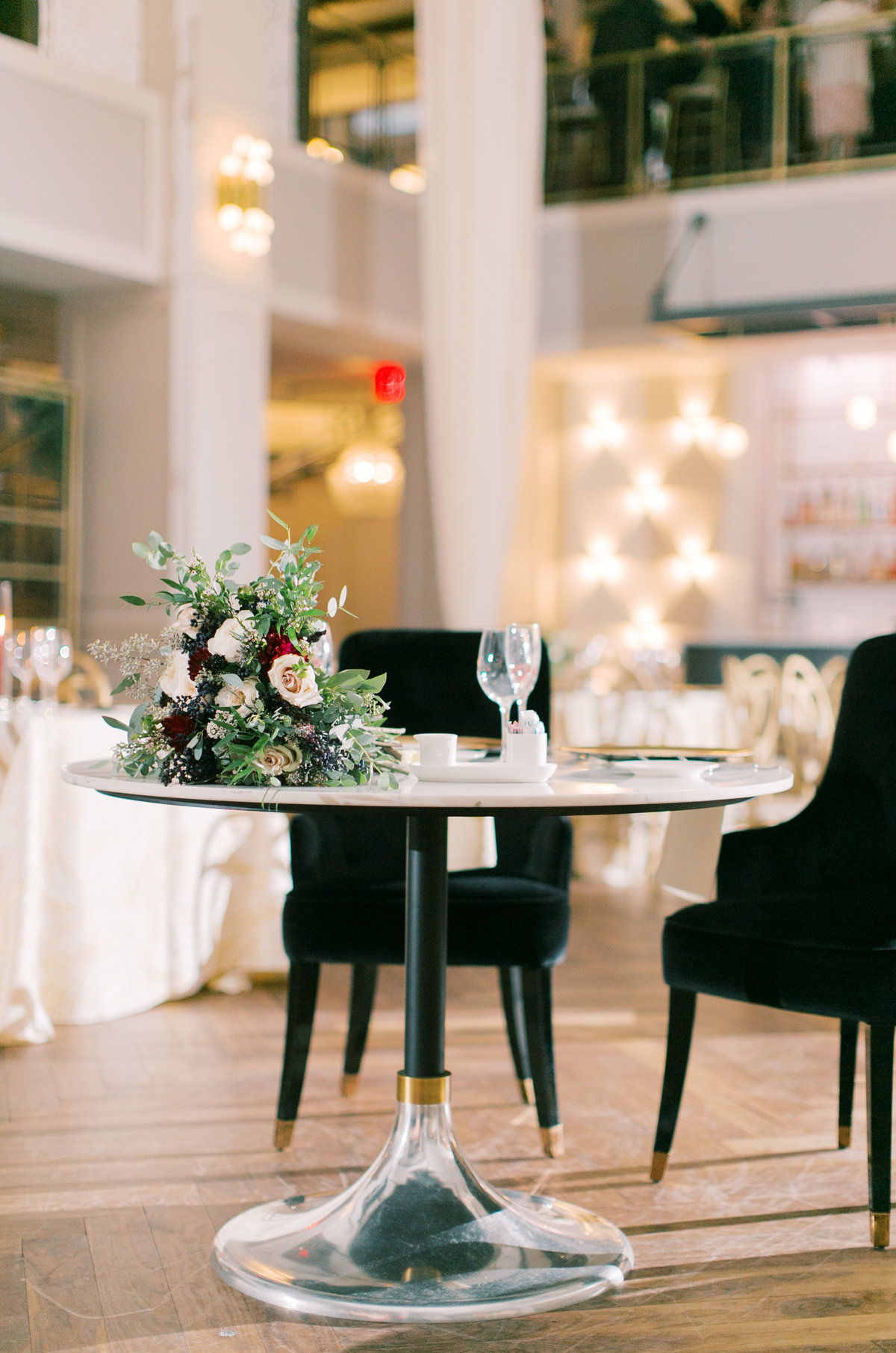 sweethearts table with round table and black chairs