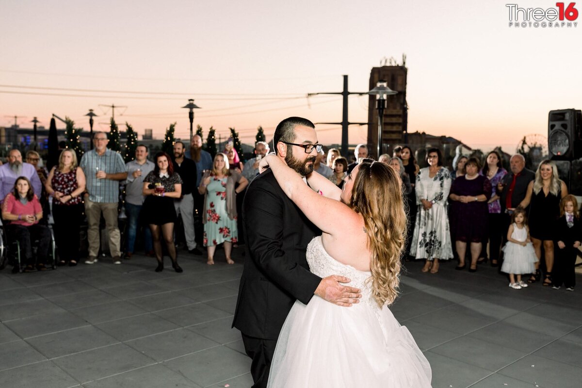 Bride and Groom share their first dance together on the rooftop at The FIFTH Rooftop Restaurant & Bar