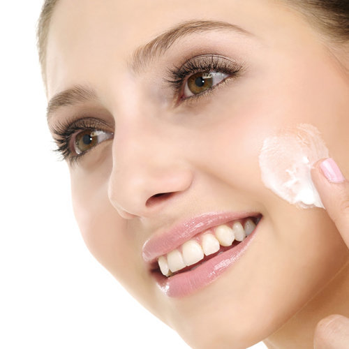 face cream on ladies face