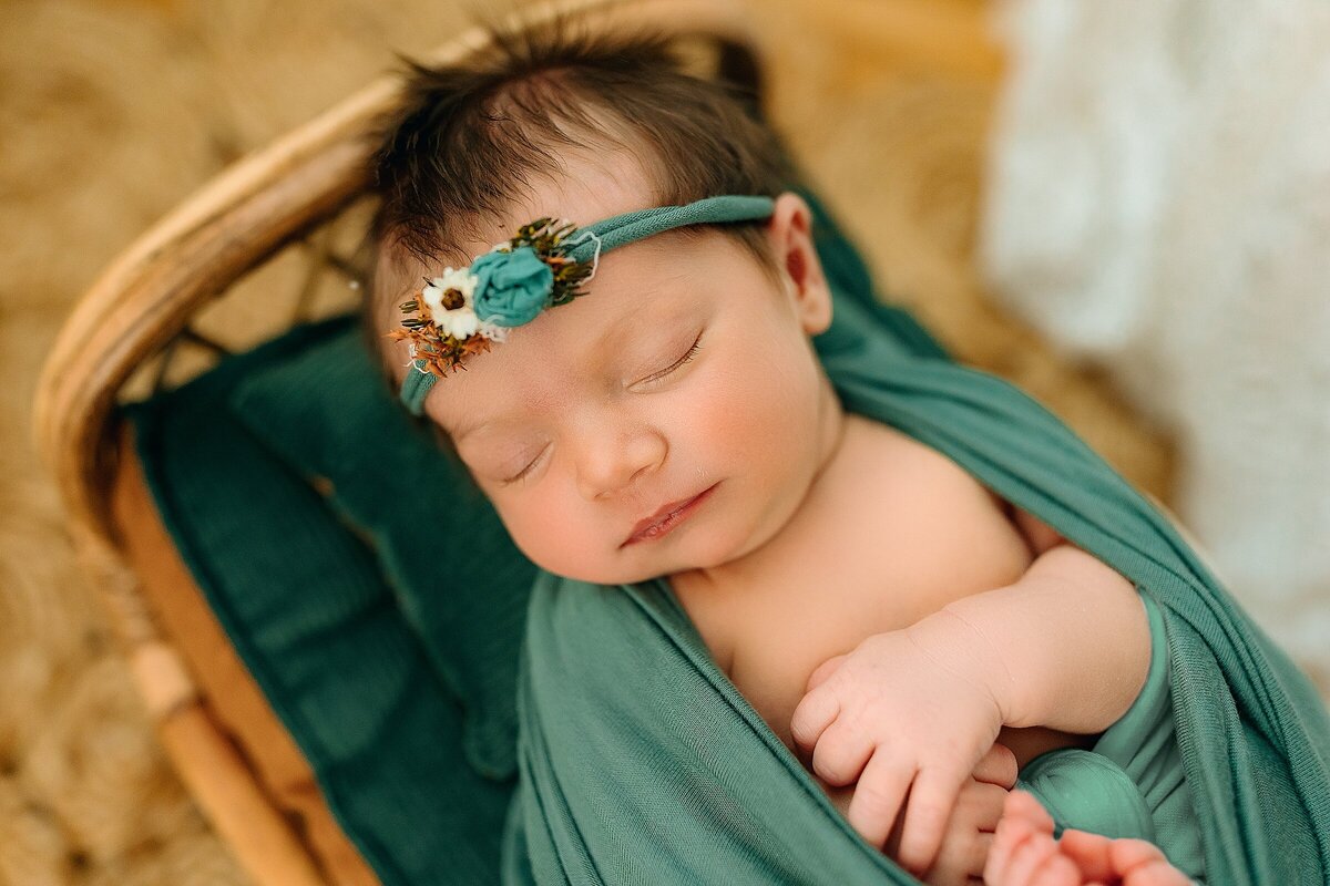 Newborn baby girl in photography studio