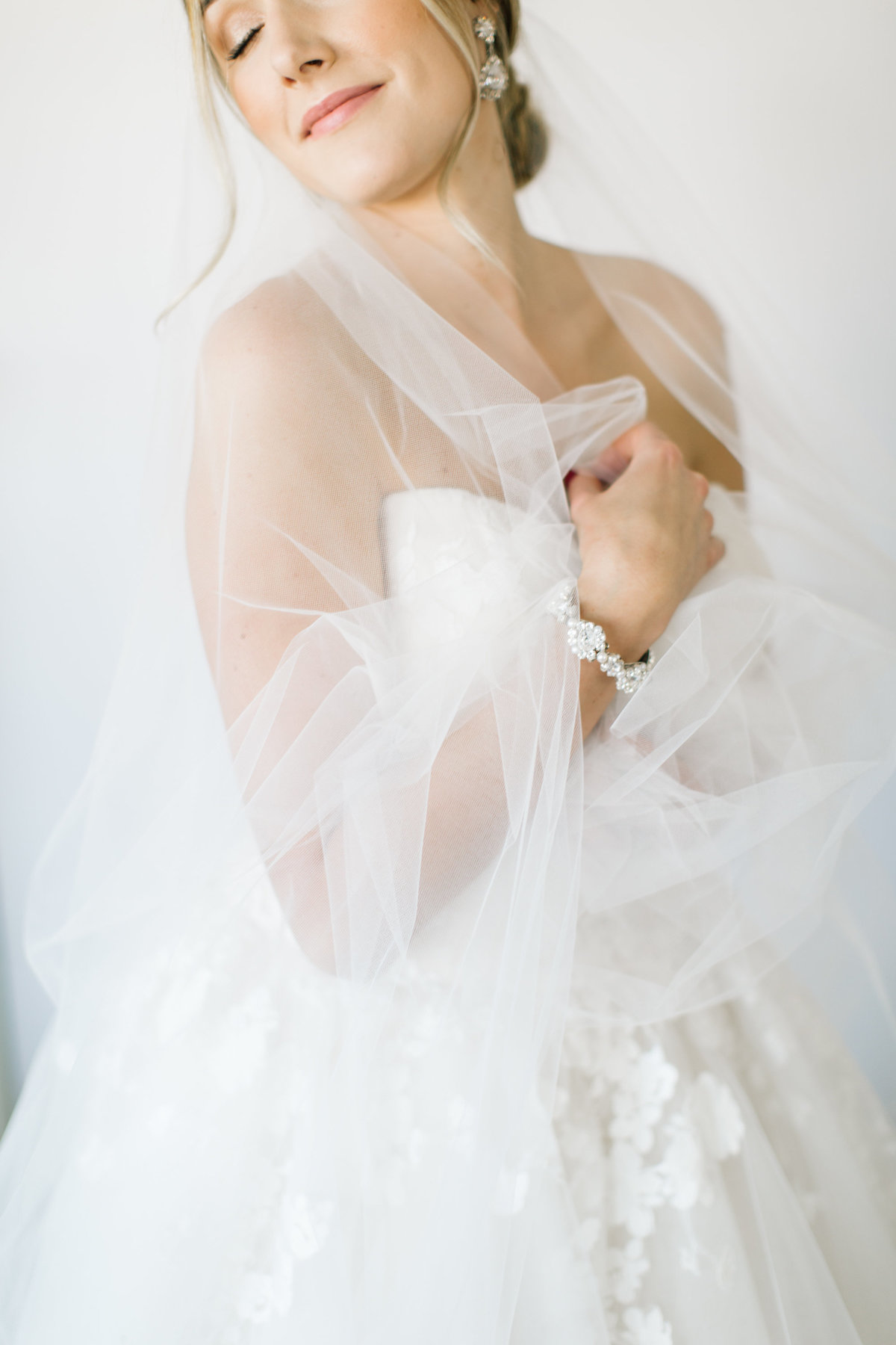 bride with veil and heirloom jewelry