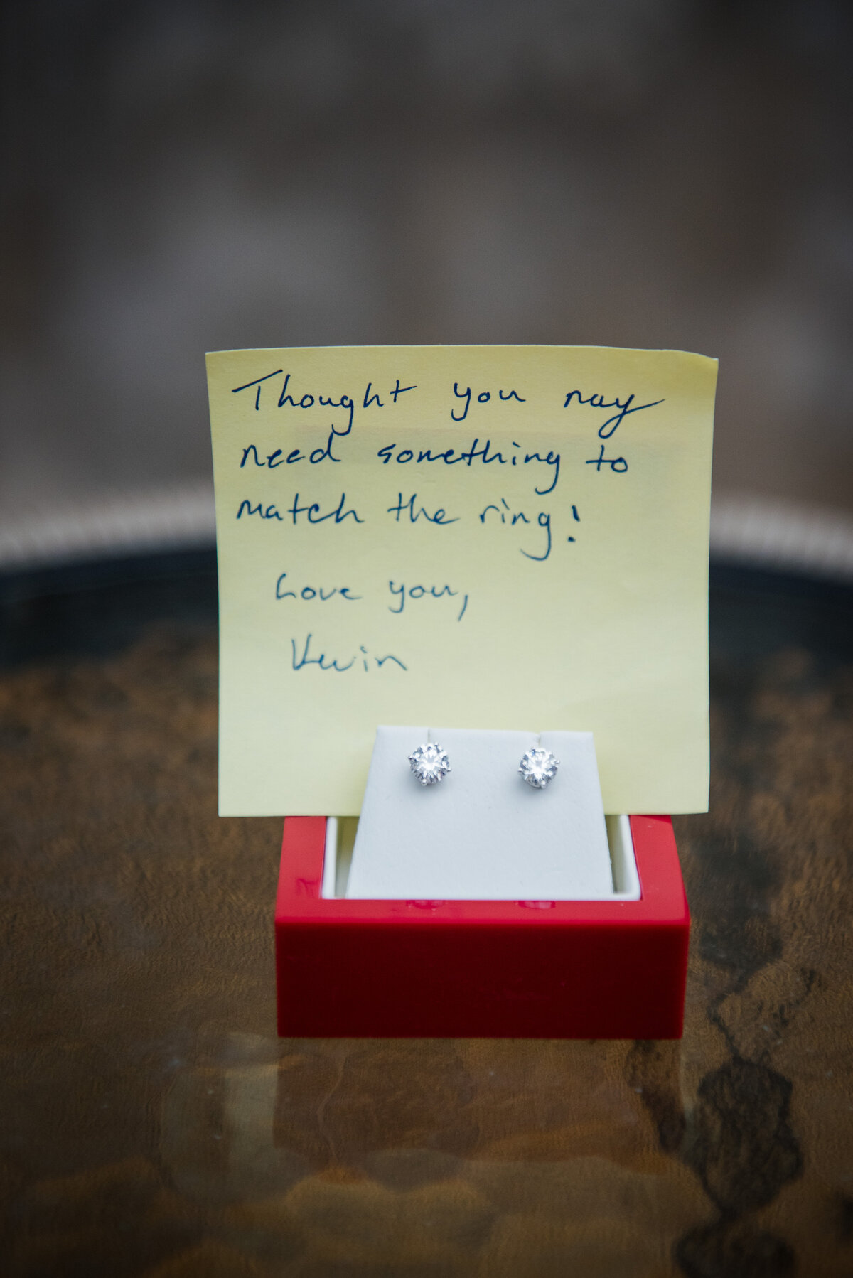 A cute note from a groom to a bride and a pair of earrings gifted by the groom.