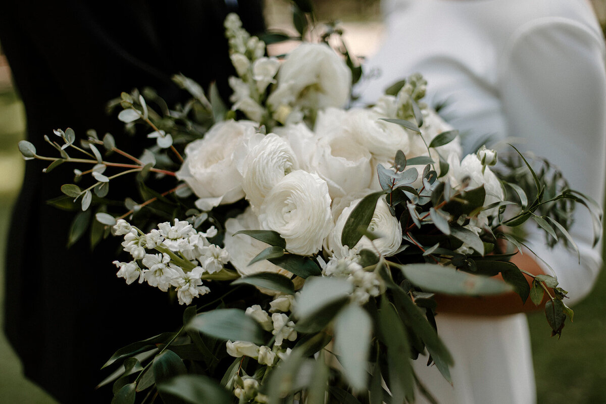 a wedding bouquet with white flowers