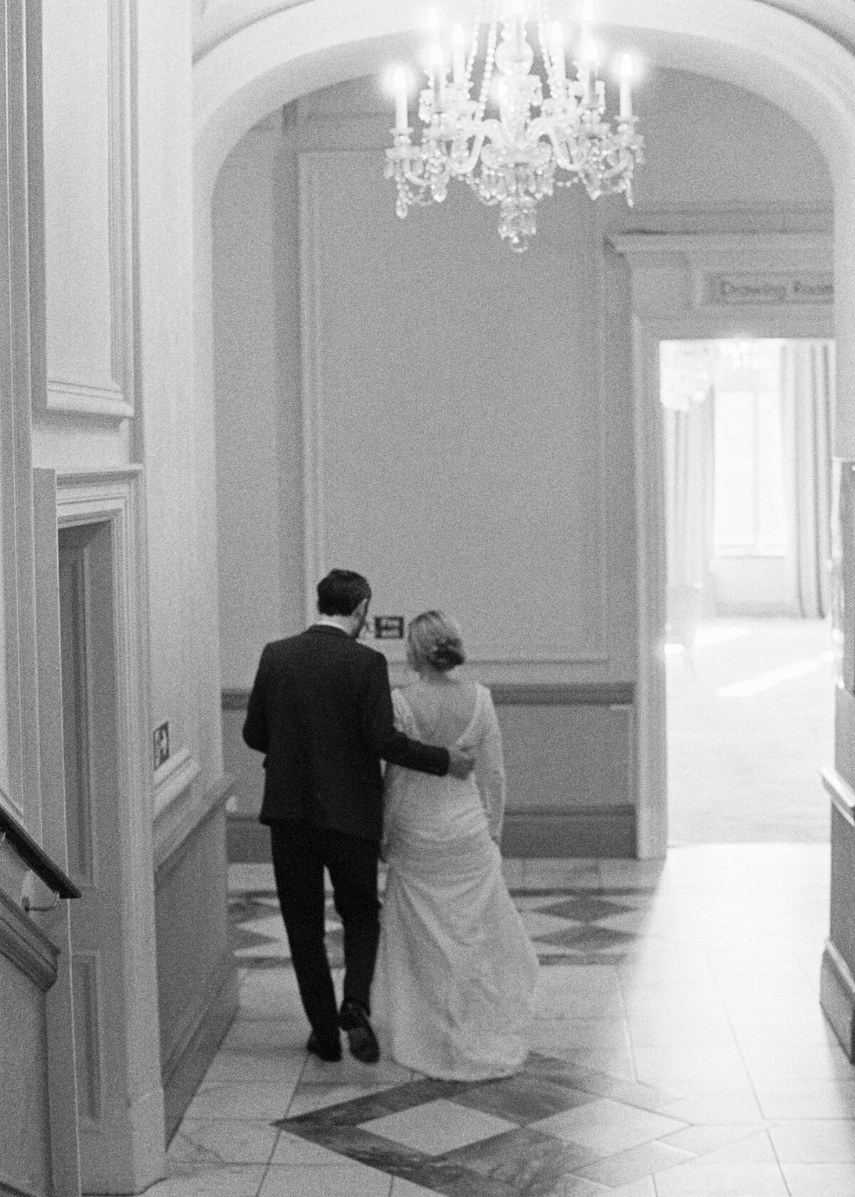 bride and groom black and white candid analogue photo