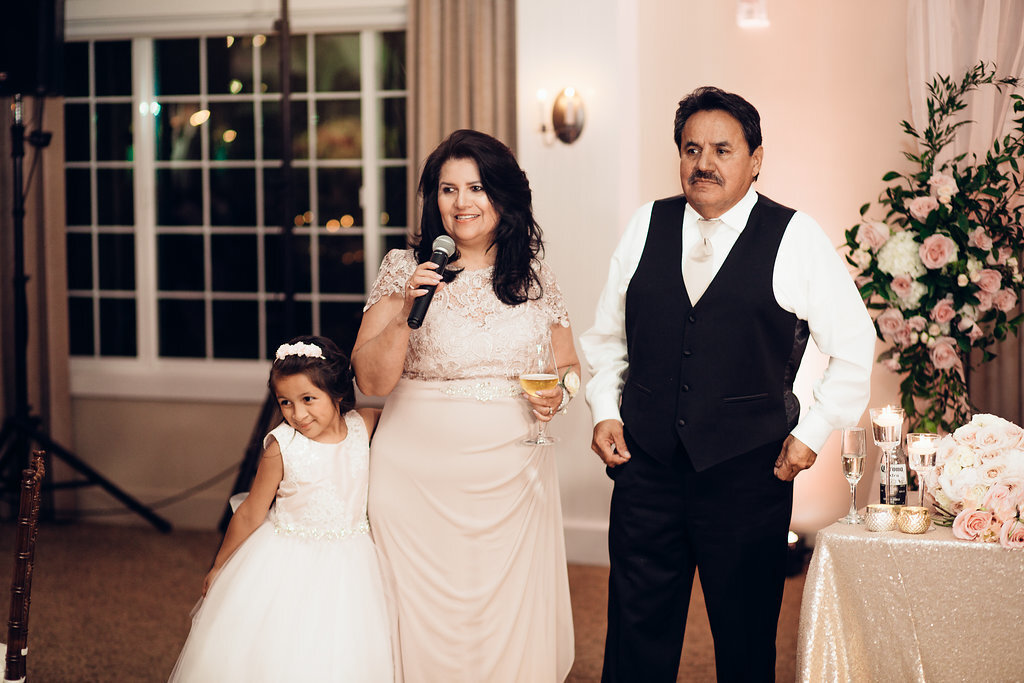 Wedding Photograph Of Man in Black Suit, Woman And a Child in Dress Los Angeles