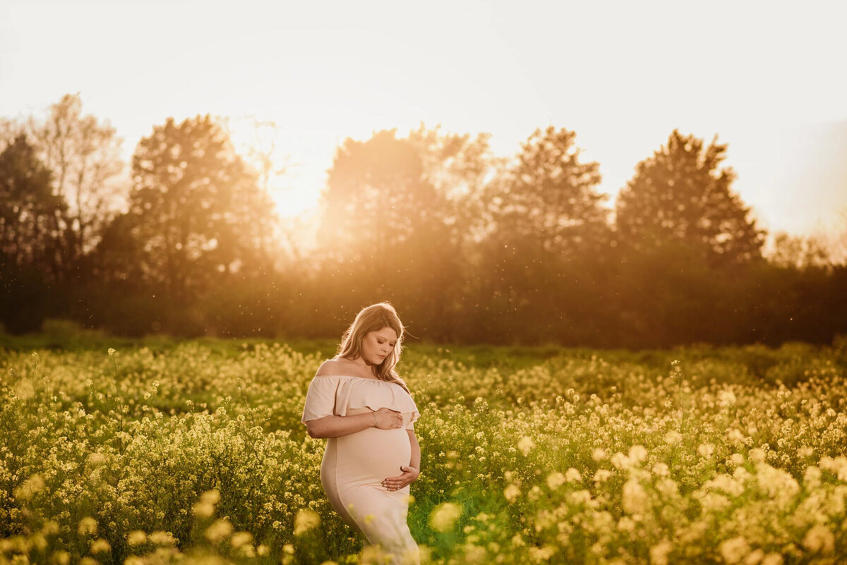 photo of pregnant woman in a flower field