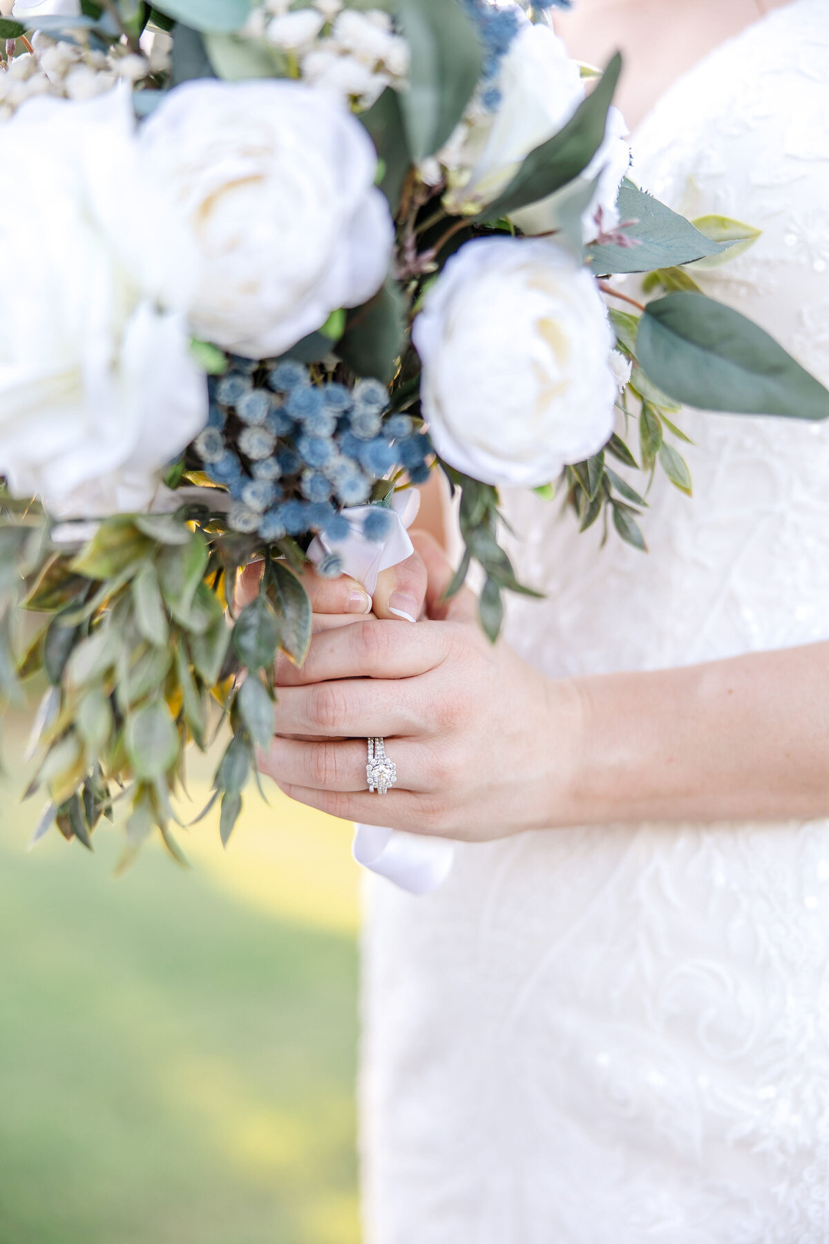 bride holding bouquet with ring in focus at wedding in Austin Texas