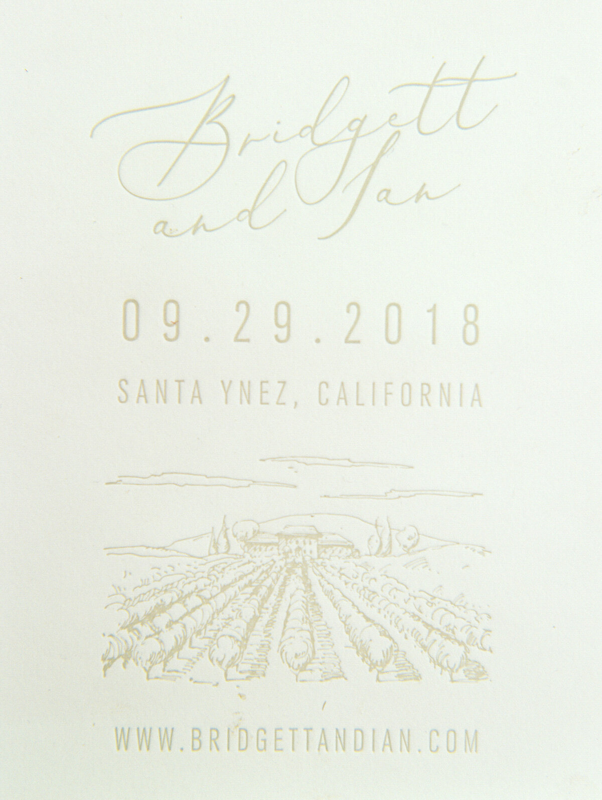 close up of letter press invitation all white with cream lettering