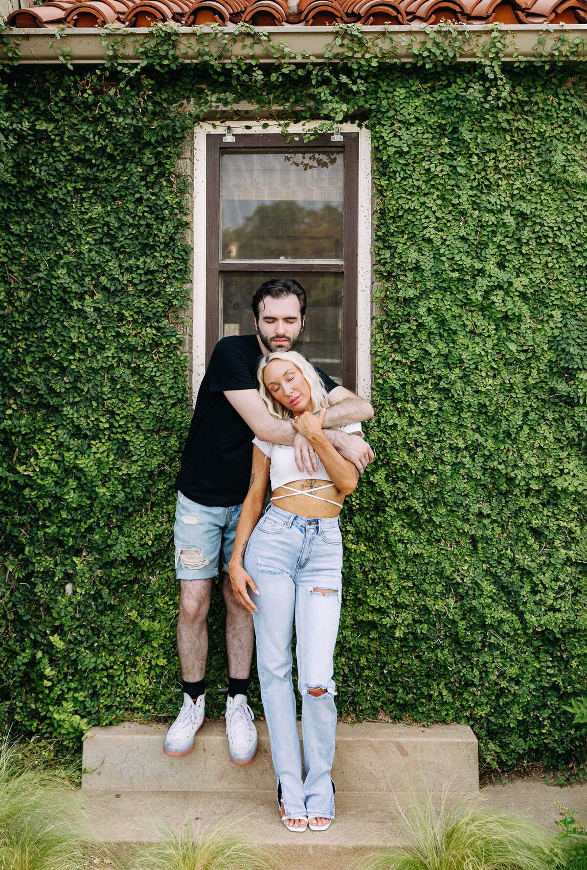 couple in front of vine wall for engagement photos europe