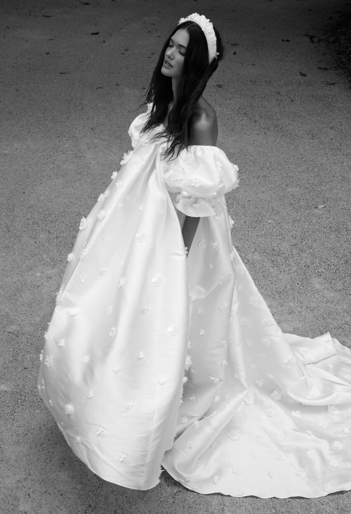 black and white image bride wearing puffy wedding dress with puff sleeves