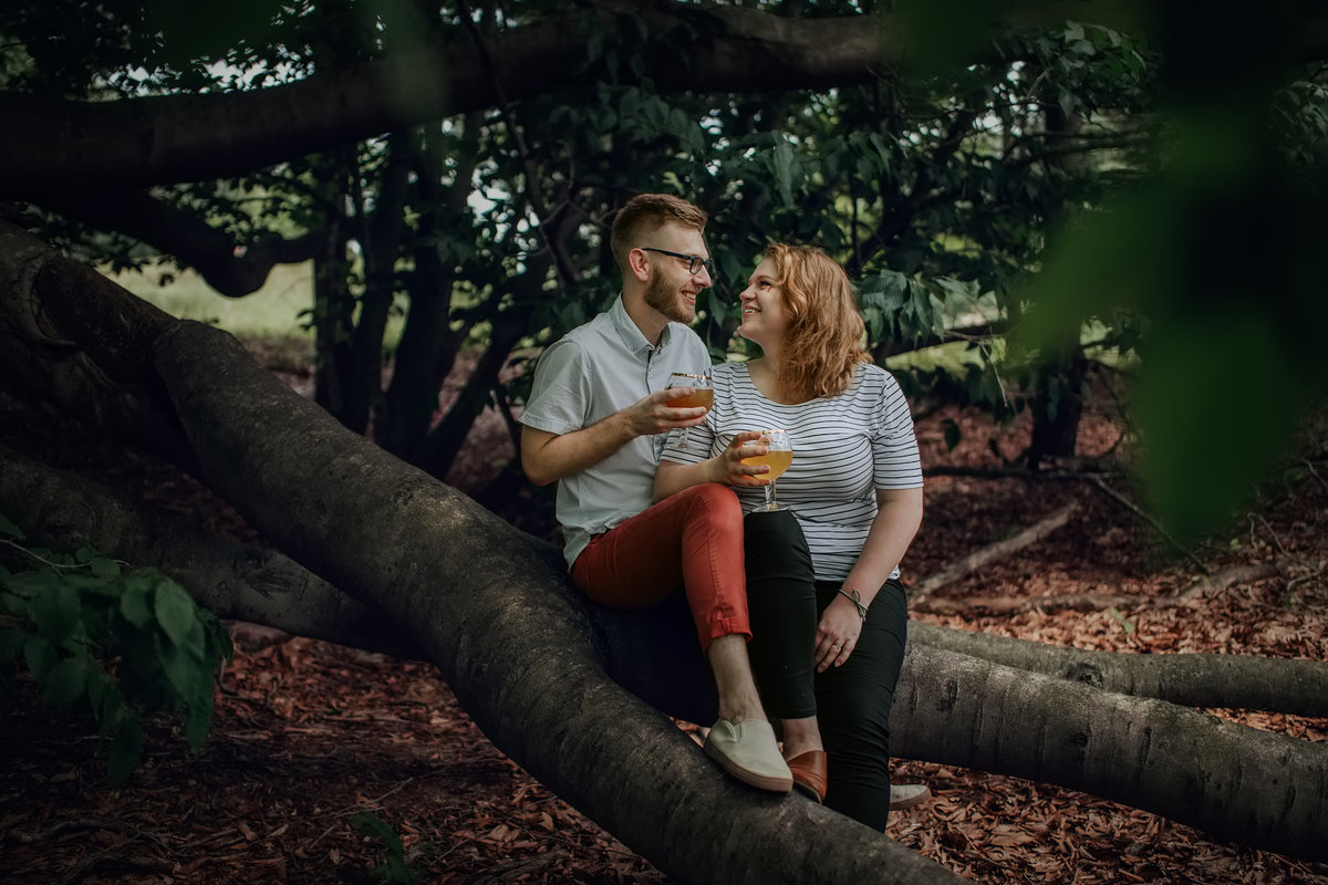 couple in woods engagement session grand rapids