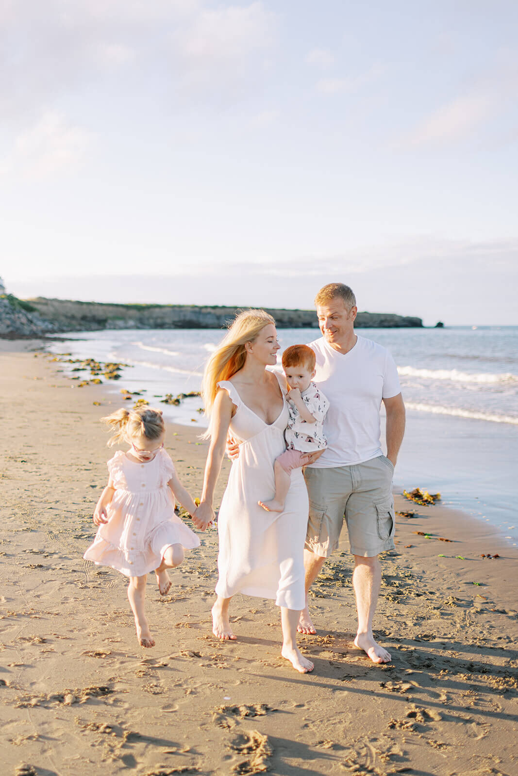 beautiful-family-walking-on-beach