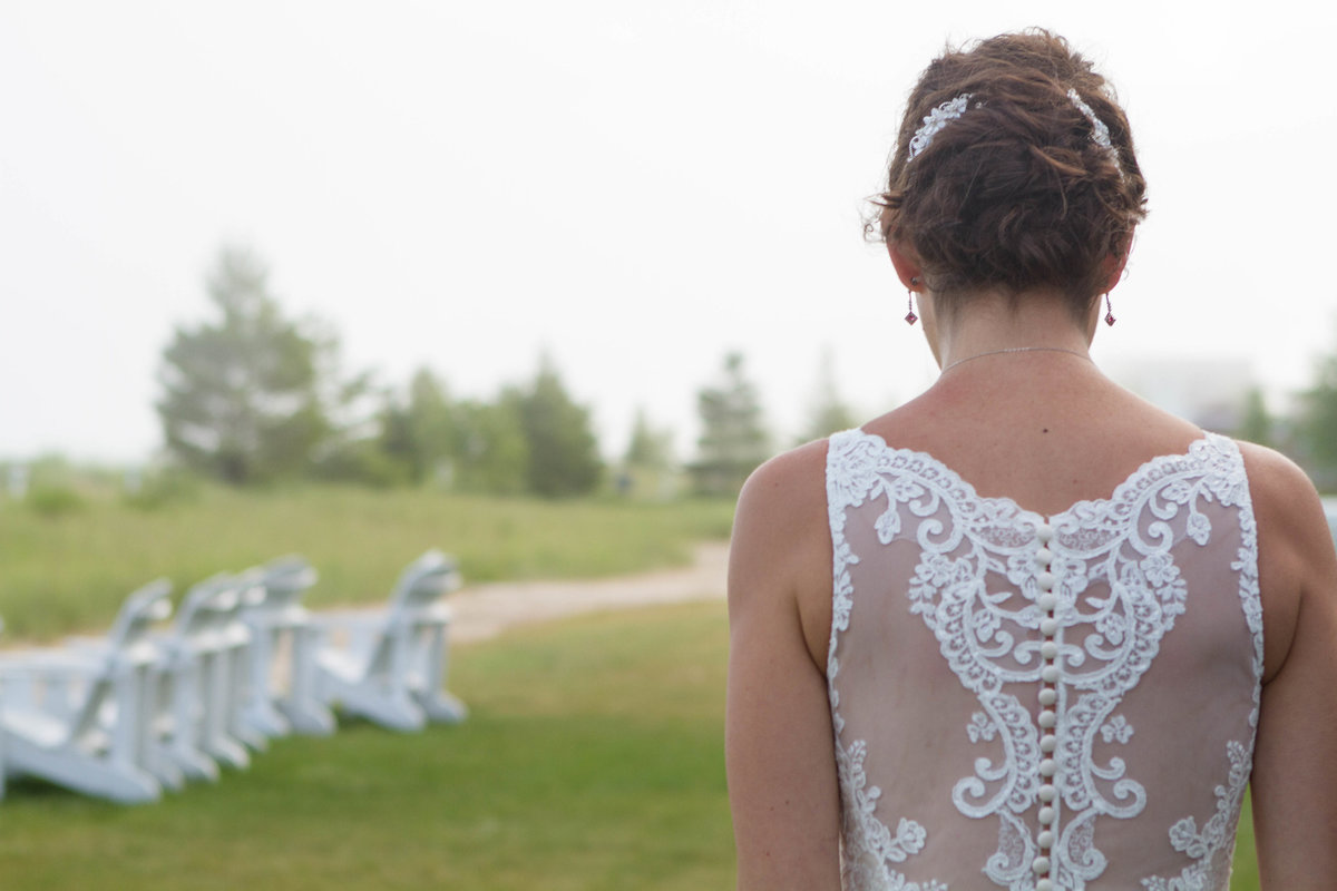 detail shot of back of dress with Adirondack chairs in background