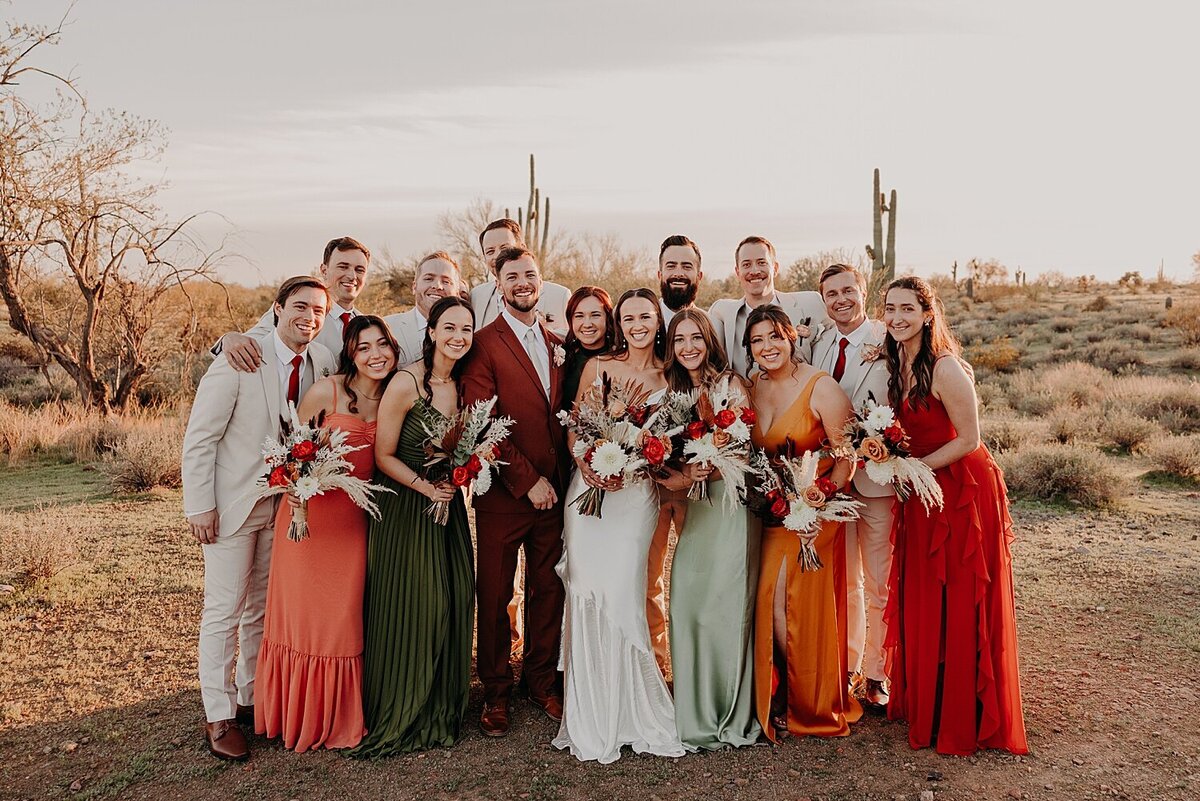 wedding party casually hug in colorful dresses