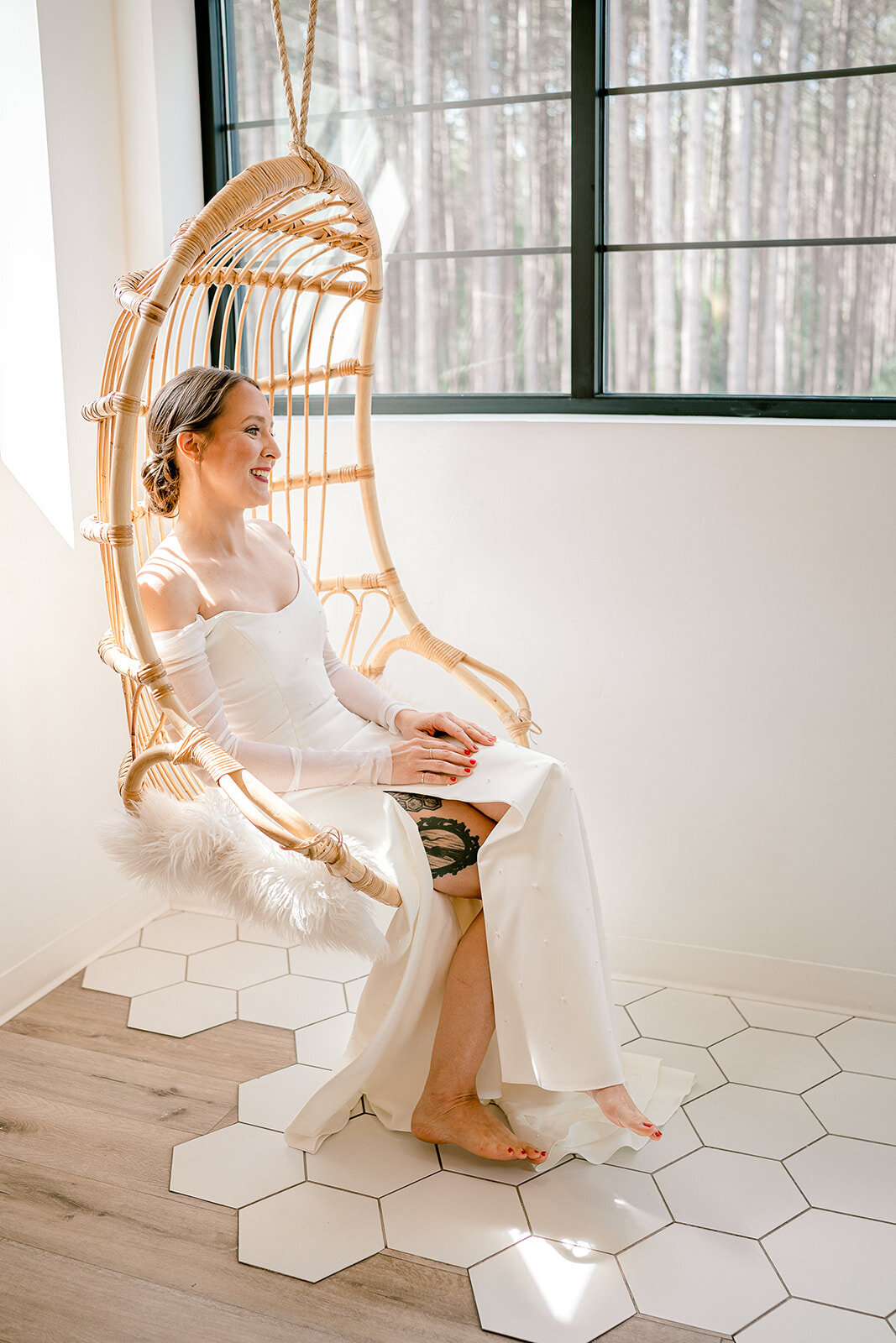 A bride relaxes in a chair at the bridal suite at Pinewood Weddings and events venue