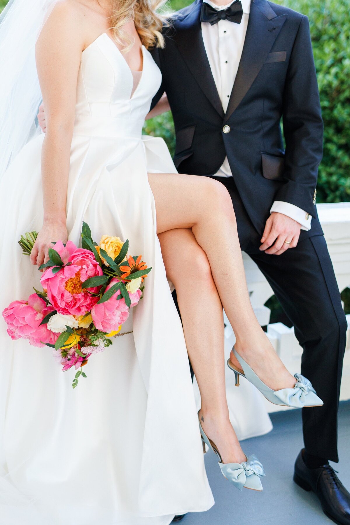 Closeup details of bouquet, shoes, and tux at Raleigh wedding by photographer Jenn Eddine