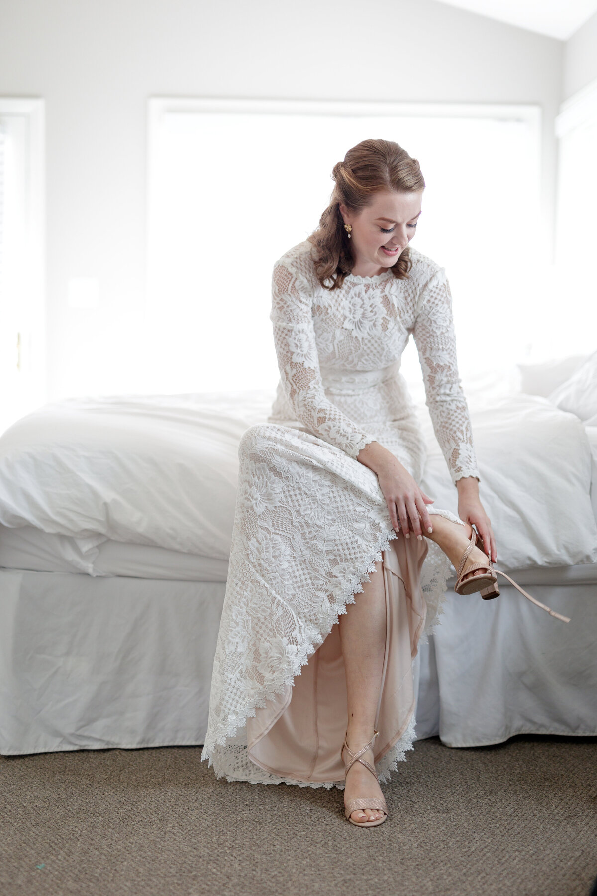 a bride gets ready at The Warfield House Inn