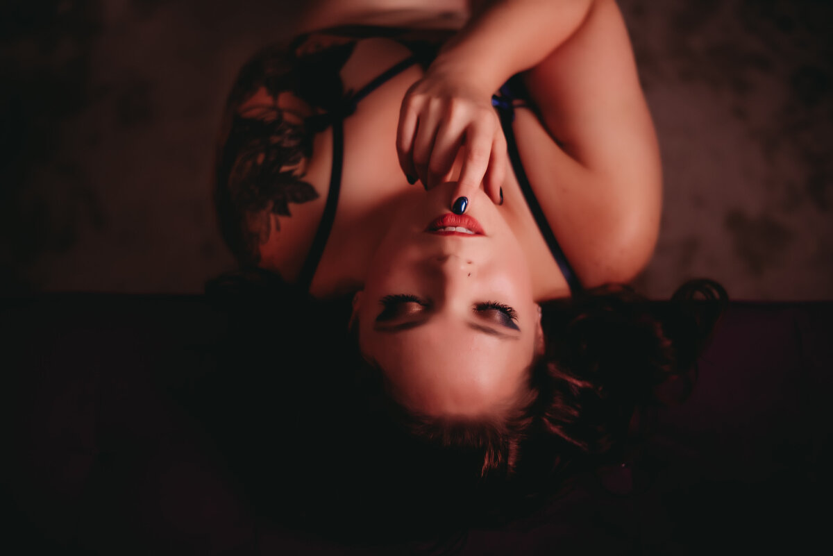 Picture of woman lying down during boudoir session