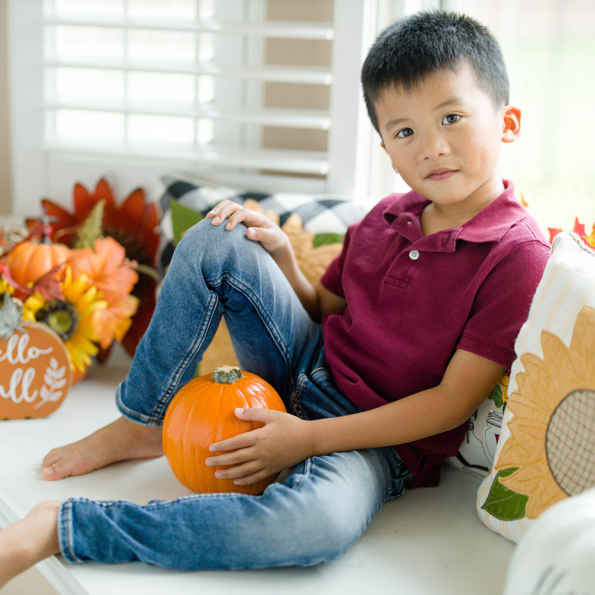 fall pumpkin photo of little boyby Lucas Mason Photography in Orlando, Windermere, Winder Garden area