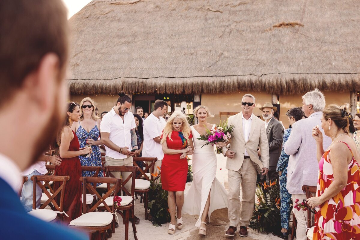 Bride walking down aisle at Blue Venado Seaside Riviera Maya wedding