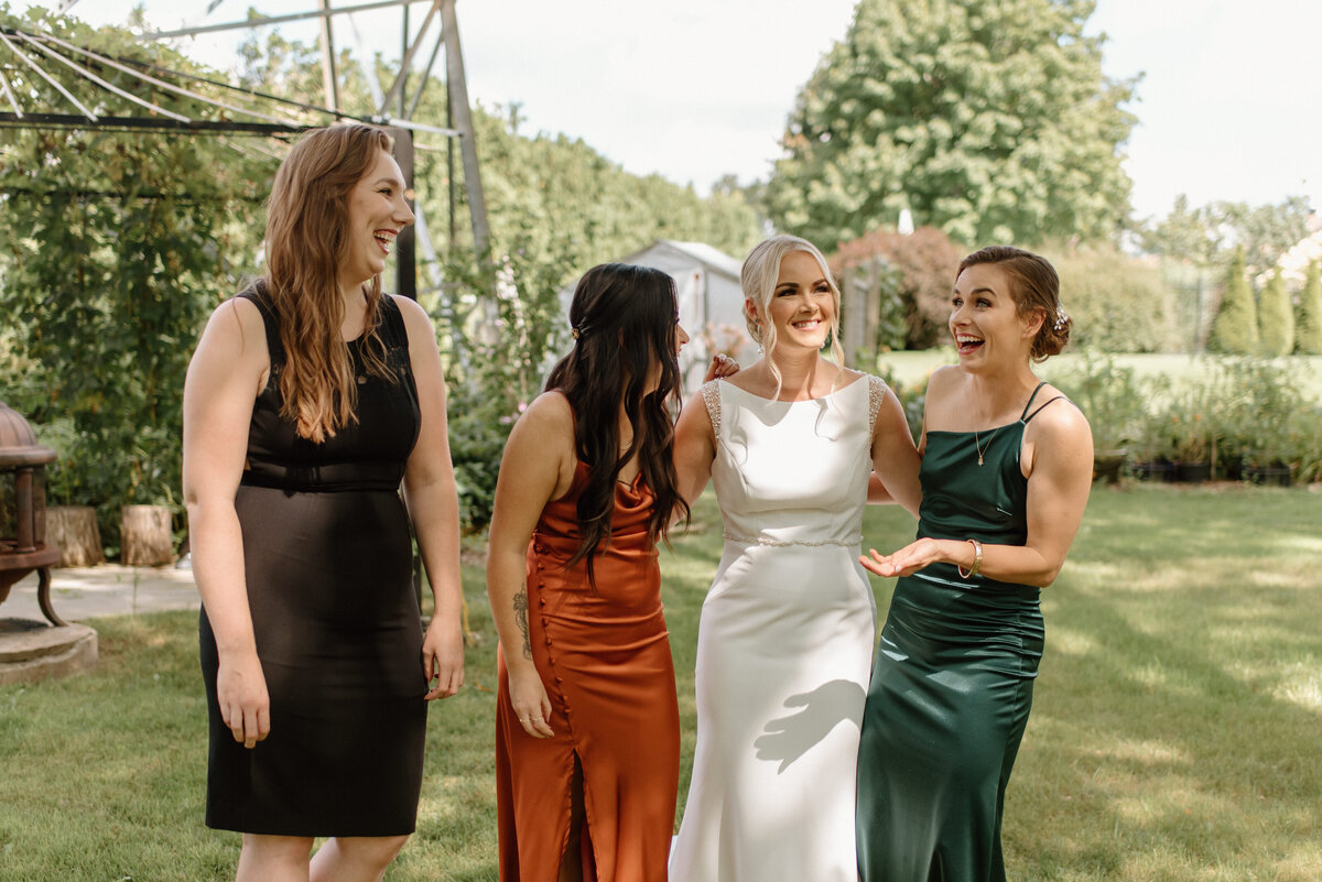 bride with her friends and sister before wedding