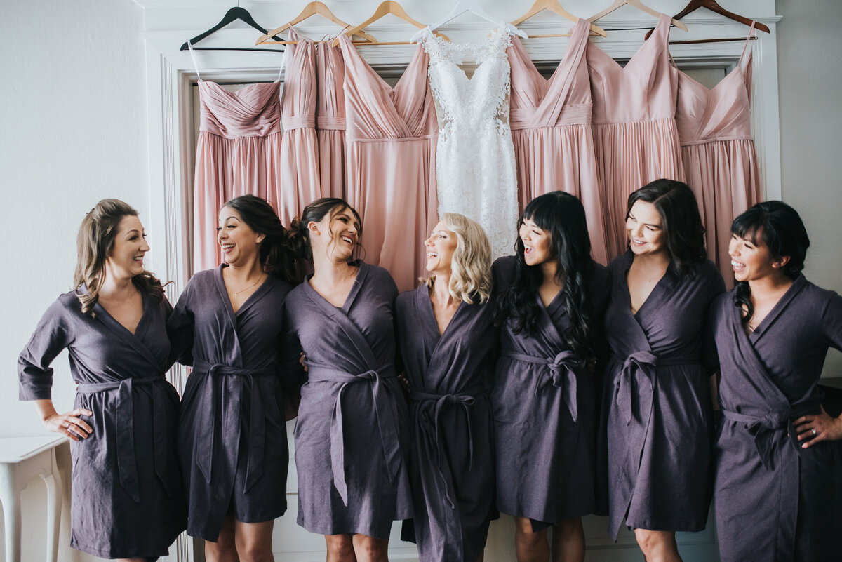 A bride shares a laughing moment with her bridesmaids in our getting ready suite.