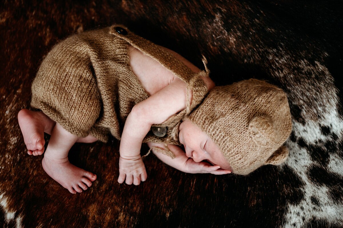 Newborn on rug McKennaPattersonPhotography