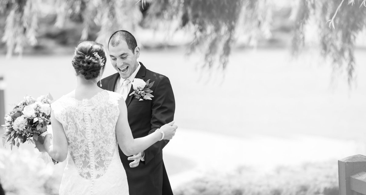 A groom is excited to see his bride during a first look.