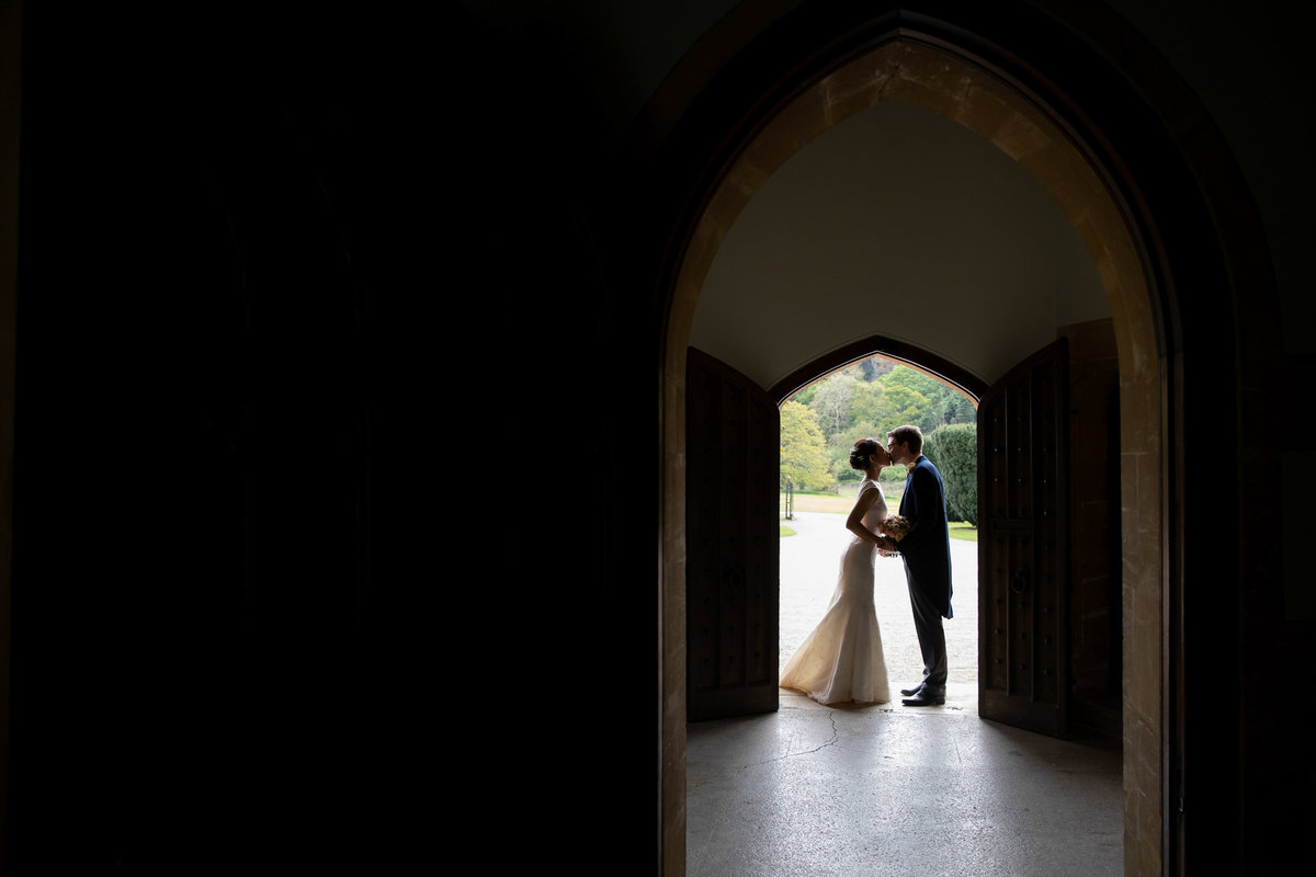 Bride and groom in the door at Somerset wedding venue St Audries park