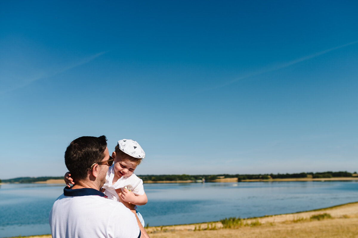 Dad and his son in the summer at rutland water during family photoshoot